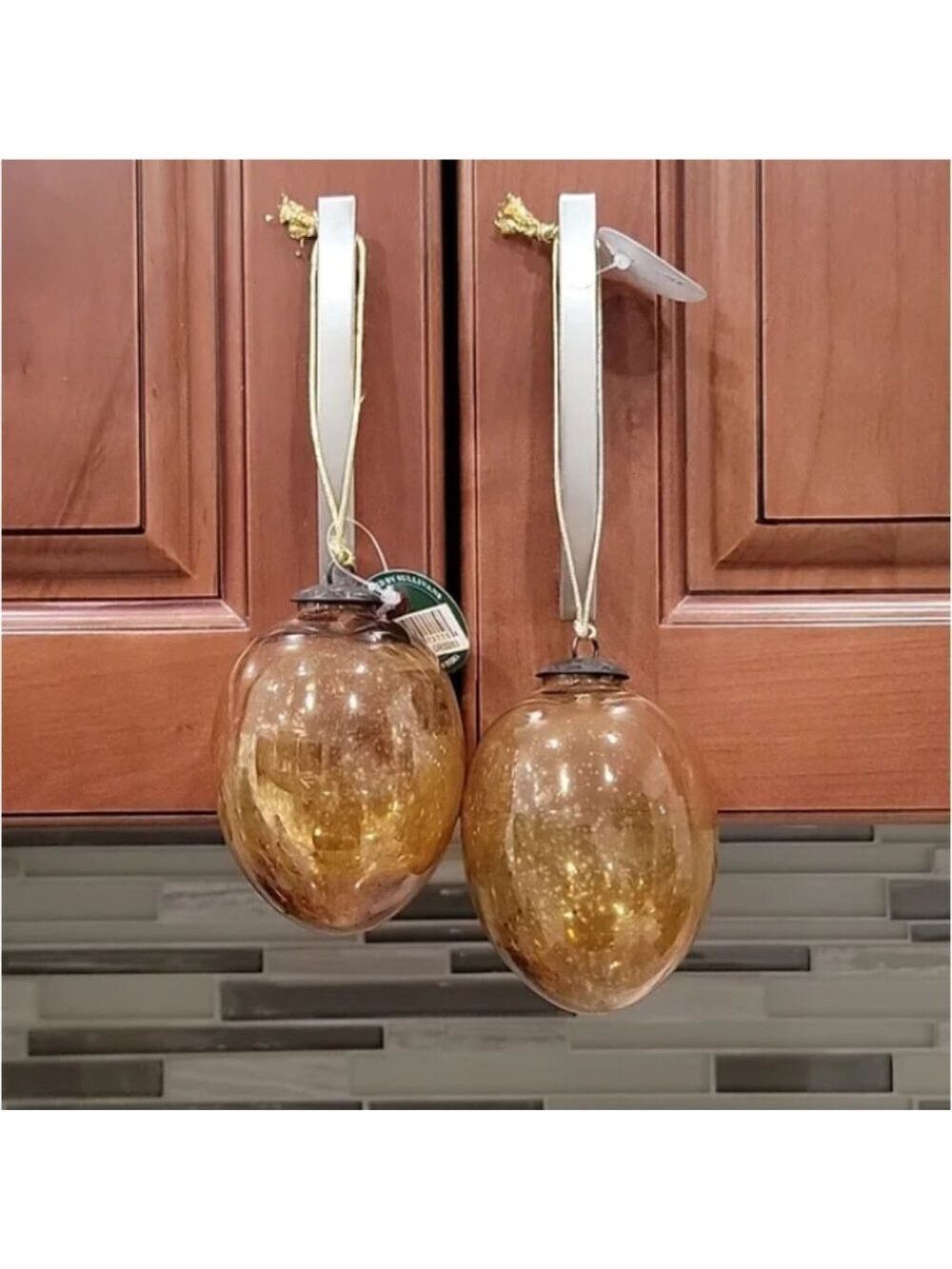 Set of two Sullivans handblown glass Amber colored ornaments